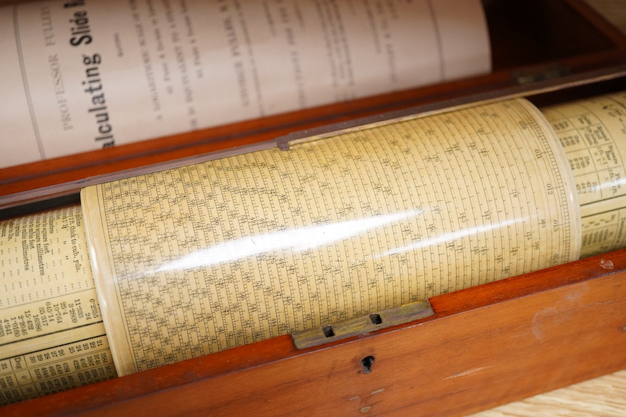 A Fuller’s Calculator, by W.F. Stanley, mahogany with a paper scale and brass cursors, mahogany cased, together with an instruction booklet, the case 35cm wide, 11cm deep, 10cm high